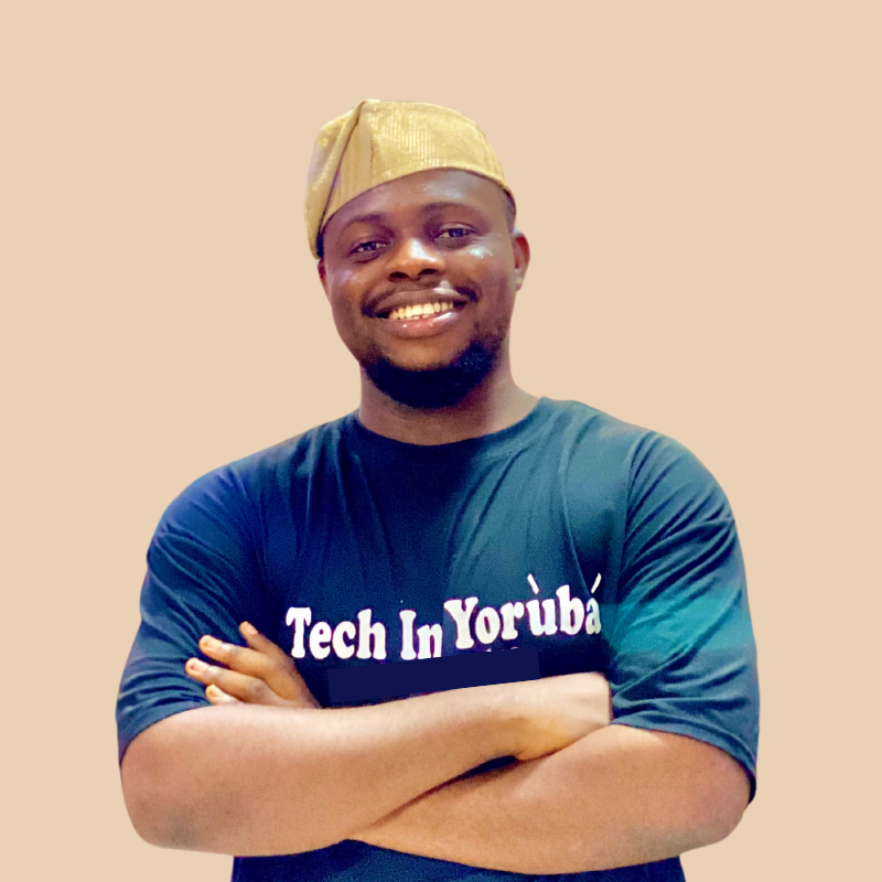 Theophilus Adegbohungbe celebrating 10 years in tech, wearing a gold Yoruba fila and Tech in Yoruba T-shirt.